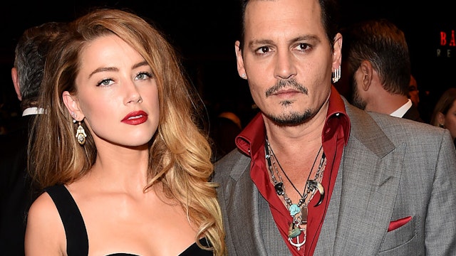 TORONTO, ON - SEPTEMBER 14: Actors Amber Heard (L) and Johnny Depp attend the "Black Mass" premiere during the 2015 Toronto International Film Festival at The Elgin on September 14, 2015 in Toronto, Canada.