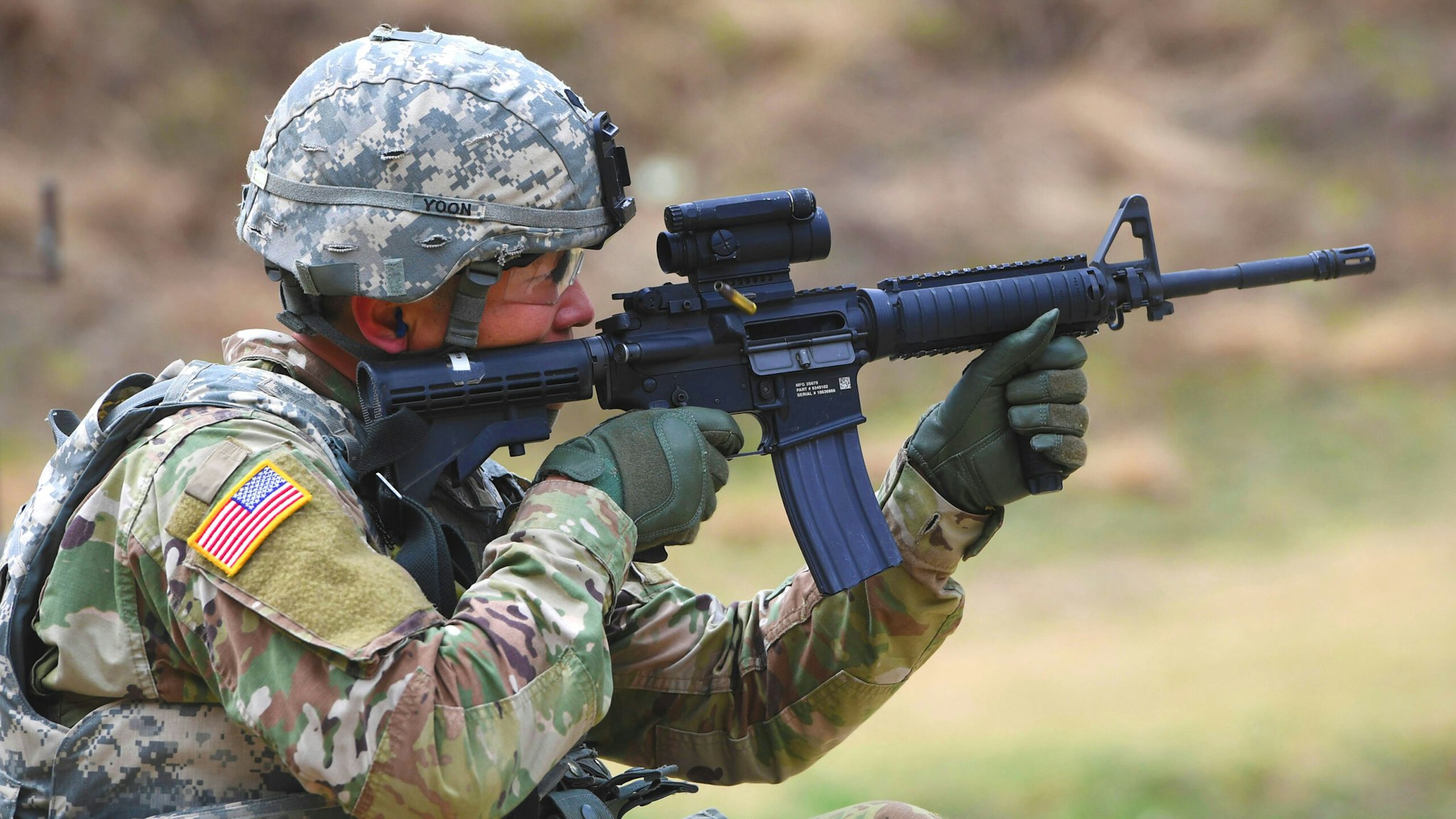 A US soldier aims his rifle at a shooting range during a Stress Shoot test of the 2018 Best Warrior Competition at Camp Casey in Dongducheon, north of Seoul, on April 10, 2018 US 2nd Infantry Division held the annual competition where 24 soldiers competed in a variety of events testing them both physically and mentally.