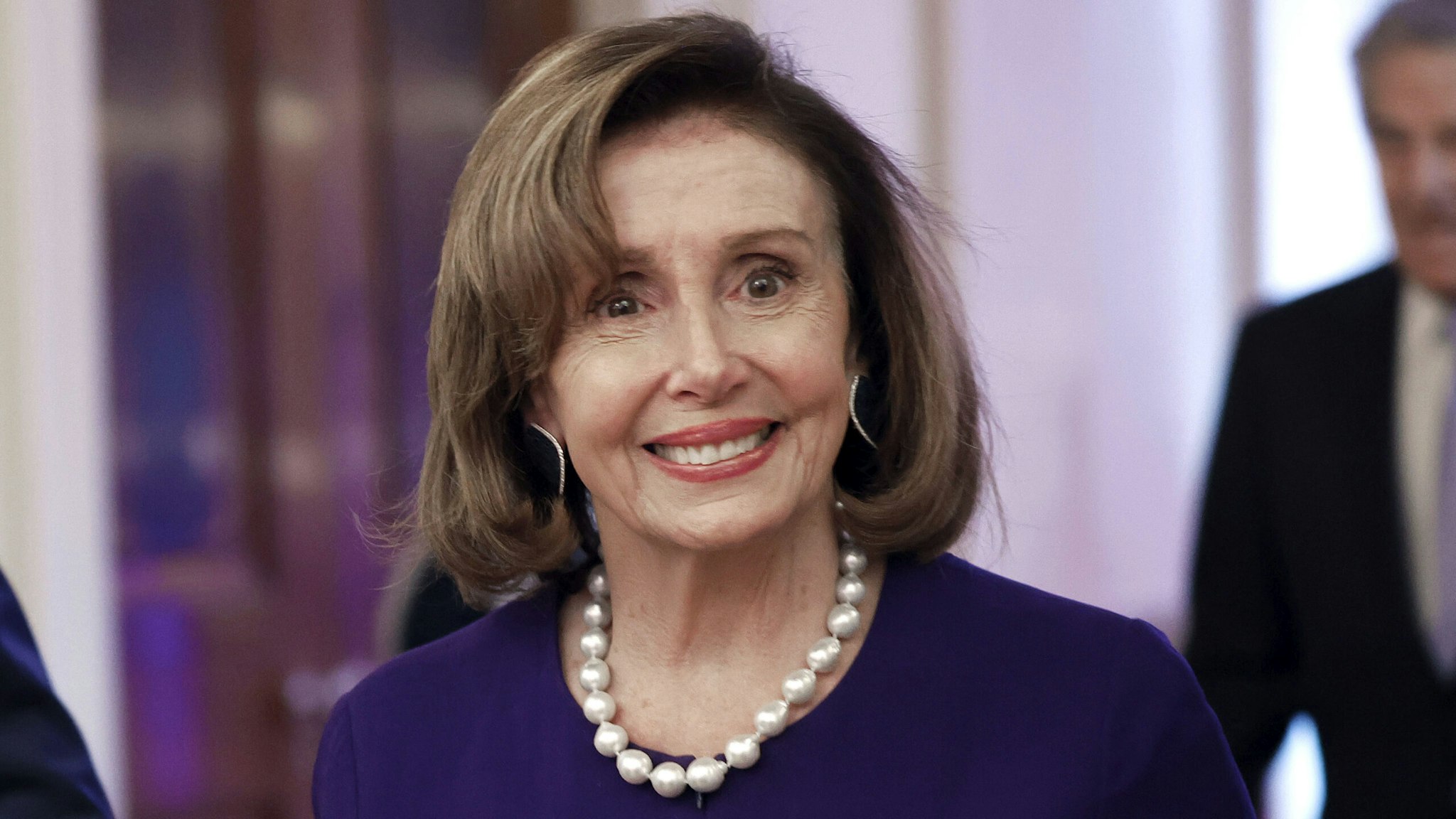 WASHINGTON, DC - MAY 16: Speaker of the House Nancy Pelosi (D-CA) (R) arrives for a reception honoring Greek Prime Minister Kyriakos Mitsotakis and his wife Mareva Mitsotakis in the East Room of the White House on May 16, 2022 in Washington, DC. U.S. President Joe Biden hosted Mitsotakis for bilateral meetings earlier in the day where they talked about allied efforts to "support the people of Ukraine and impose economic costs on Russia for its unprovoked aggression," according to the White House.