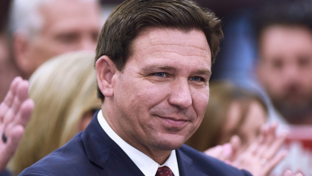 Florida Governor Ron DeSantis listens to a speaker at a press conference at Club in Ocala, where he signed into law more than $1.2 billion in tax relief for Floridians, the largest tax relief package in Florida