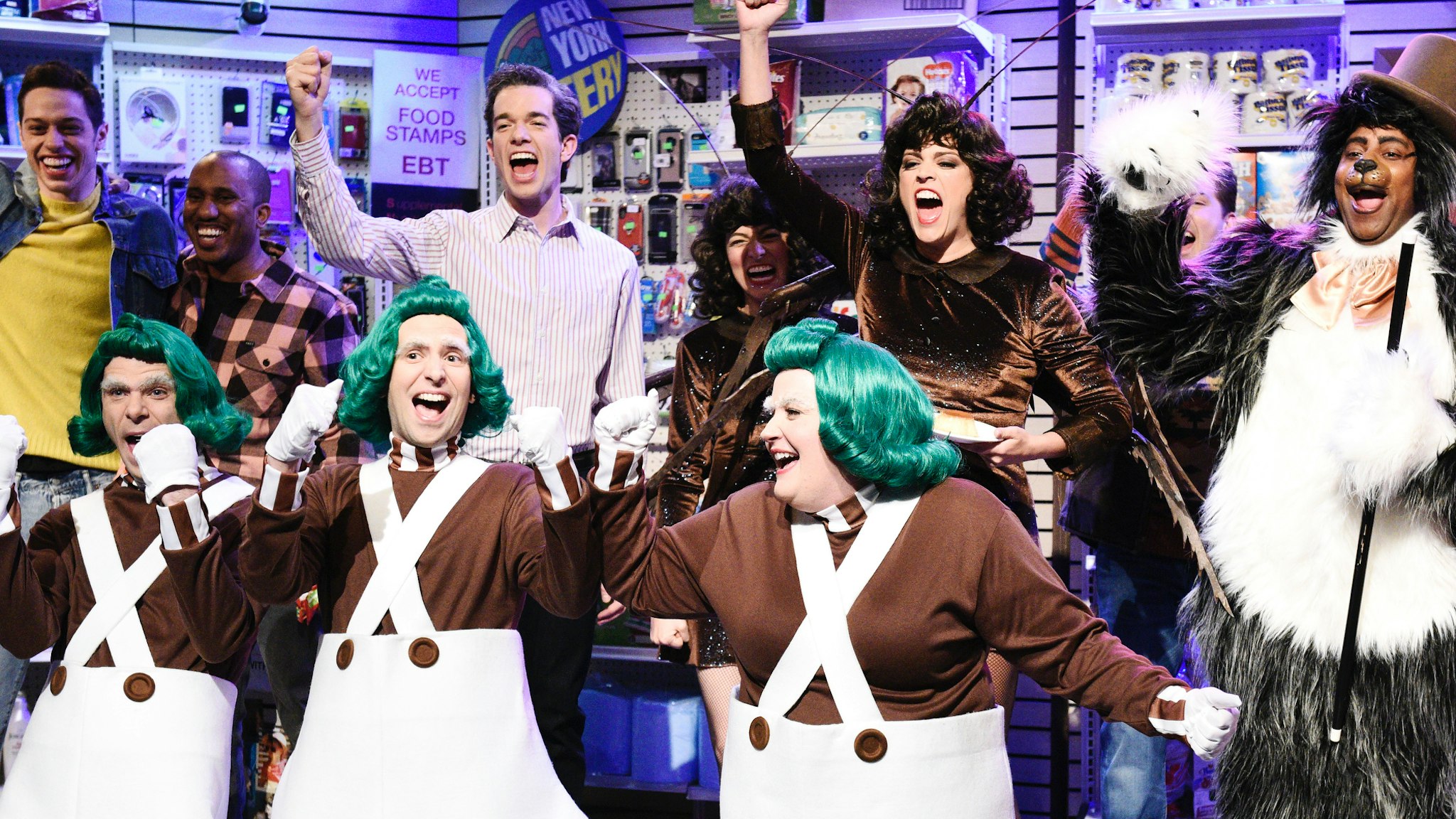 Pete Davidson, Mikey Day, Chris Redd, Kyle Mooney, host John Mulaney, Aidy Bryant, Melissa Villaseñor, Cecily Strong, Beck Bennett, Kenan Thompson as the Bodgea Cat, and Kate McKinnon during the "Bodega Bathroom" sketch on Saturday, March 2, 2019.