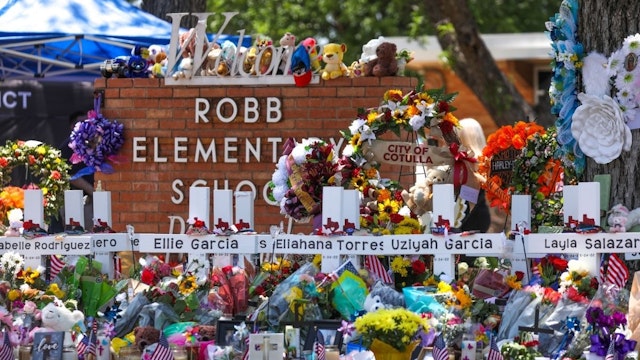 People visit a memorial for the victims of the mass shooting at Robb Elementary School on May 28, 2022 in Uvalde, Texas, United States.