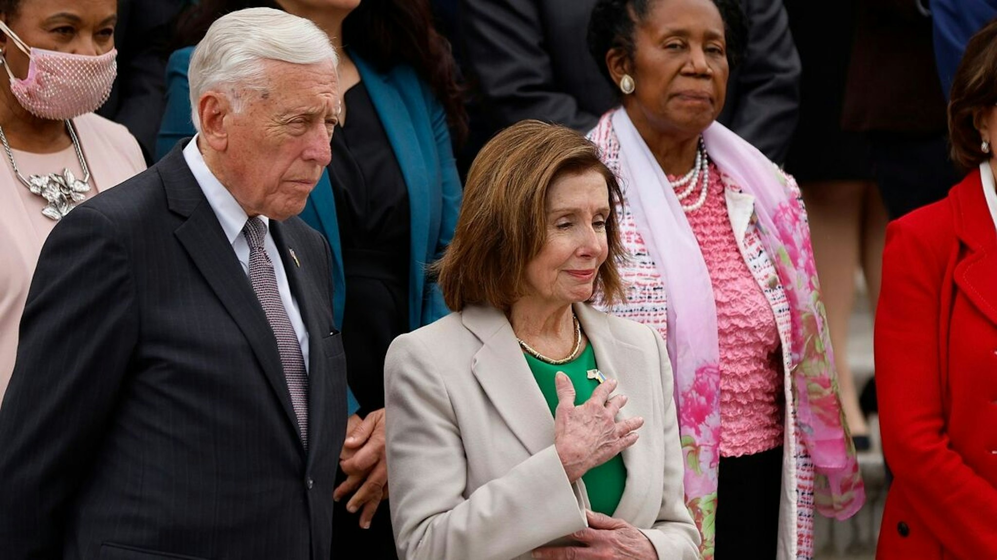 WASHINGTON, DC - MAY 12: House Majority Leader Steny Hoyer (D-MD) (L) and Speaker of the House Nancy Pelosi (D-CA) lead Democratic members of the House of Representatives in observing a moment of silence to mark one million American deaths from the coronavirus on the East Front of the U.S. Capitol May 12, 2022 in Washington, DC. According to Johns Hopkins University, as of Thursday the COVID-19 pandemic has killed 998,824 Americans and claimed more than 6.2 million lives around the world.