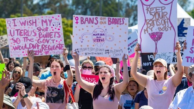 Santa Ana, CA - May 14: Many of the thousands of people attending the Bans Off Abortion rally carried signs and shouted for women"u2019s rights at Centennial Park in Santa Ana on Saturday, May 14, 2022.