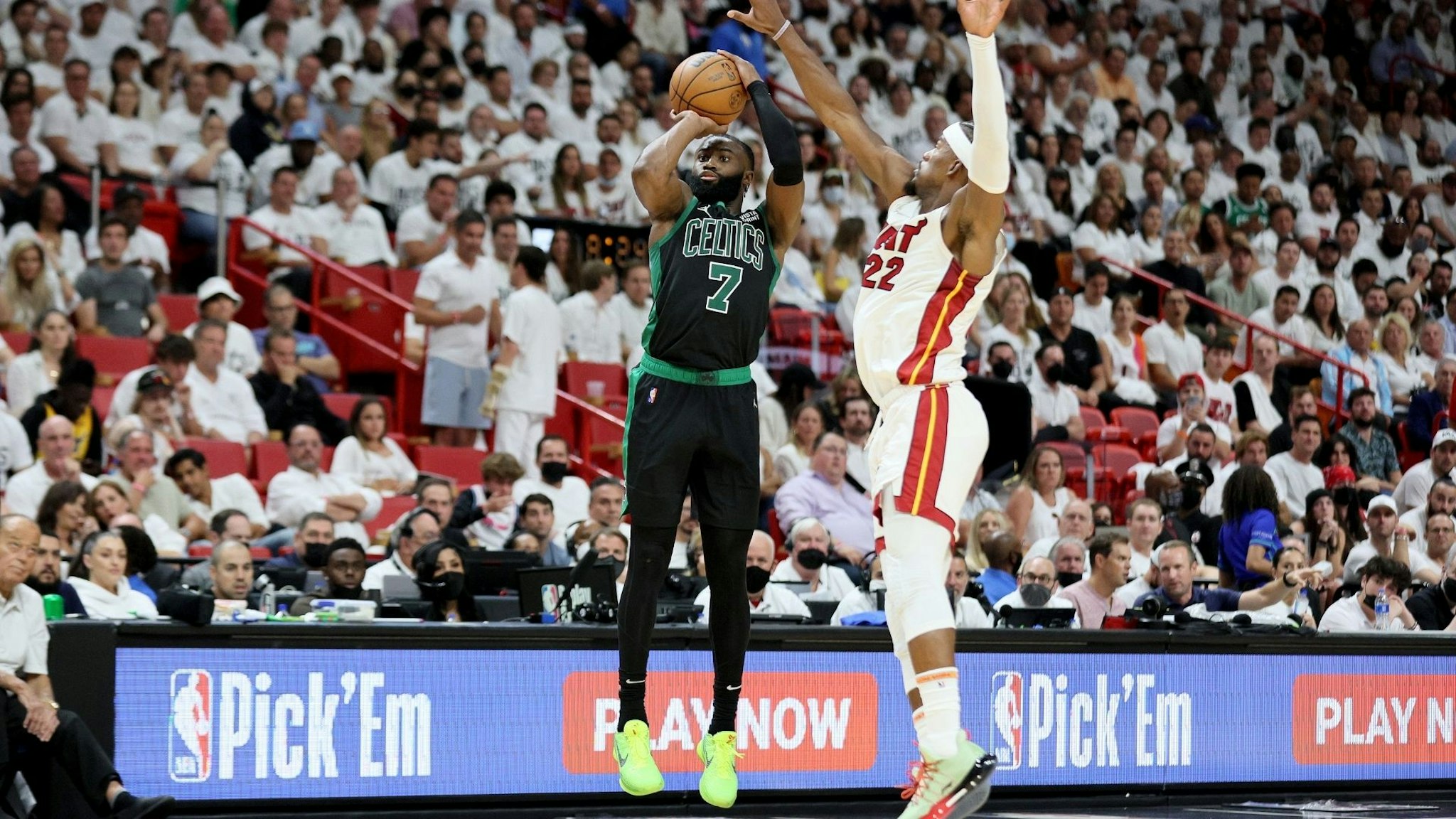 MIAMI, FLORIDA - MAY 25: Jaylen Brown #7 of the Boston Celtics shoots the ball against Jimmy Butler #22 of the Miami Heat during the fourth quarter in Game Five of the 2022 NBA Playoffs Eastern Conference Finals at FTX Arena on May 25, 2022 in Miami, Florida. NOTE TO USER: User expressly acknowledges and agrees that, by downloading and or using this photograph, User is consenting to the terms and conditions of the Getty Images License Agreement.