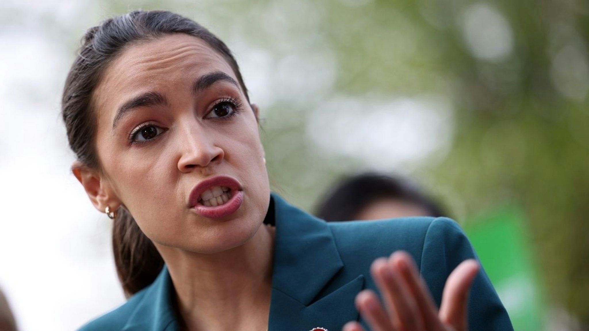 U.S. Rep. Alexandria Ocasio-Cortez (D-NY) speaks at a press conference urging the inclusion of the Civilian Climate Corps., a climate jobs program, in the budget reconciliation bill, outside of the U.S. Capitol on July 20, 2021 in Washington, DC.