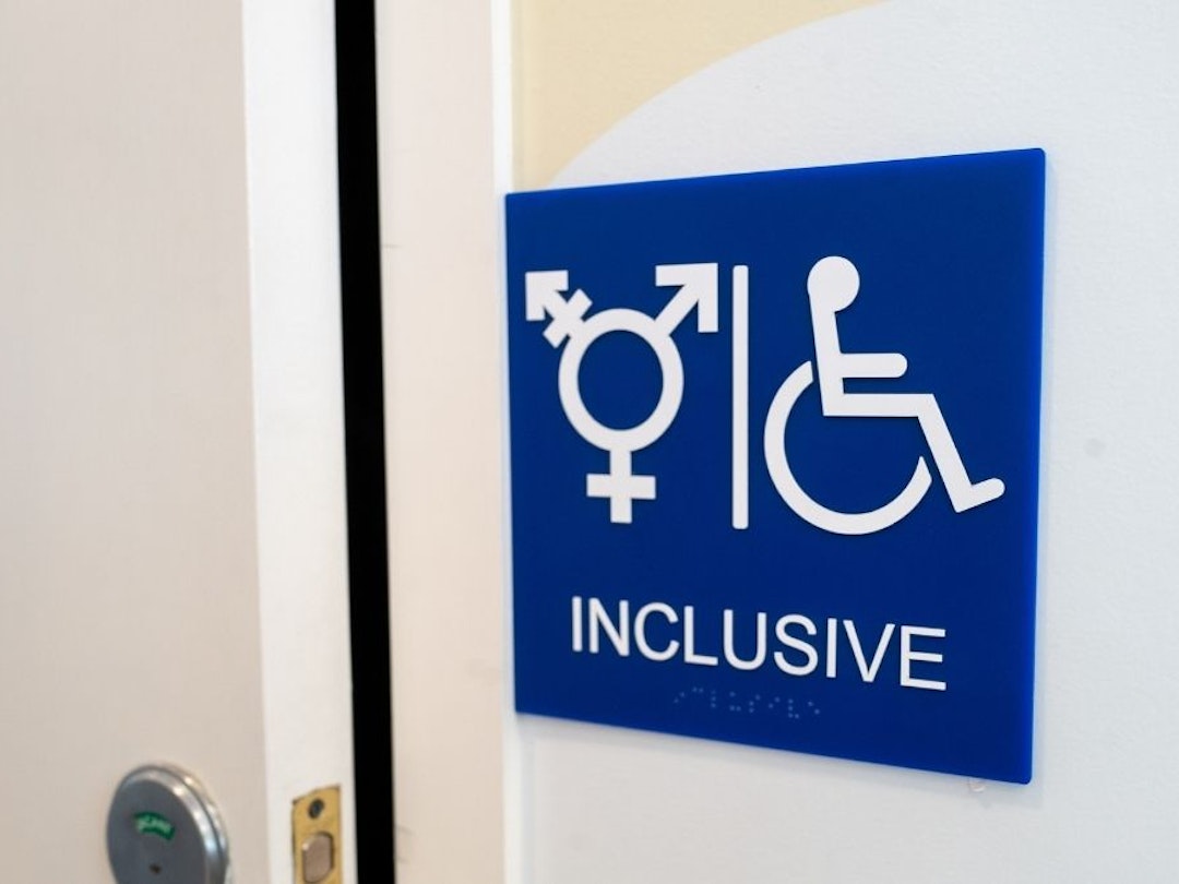 Sign for inclusive restroom, with symbol indicating male, female and transgender as well as handicapped symbol, part of LGBT rights initiatives in the Mission District neighborhood of San Francisco, California, July 18, 2019.