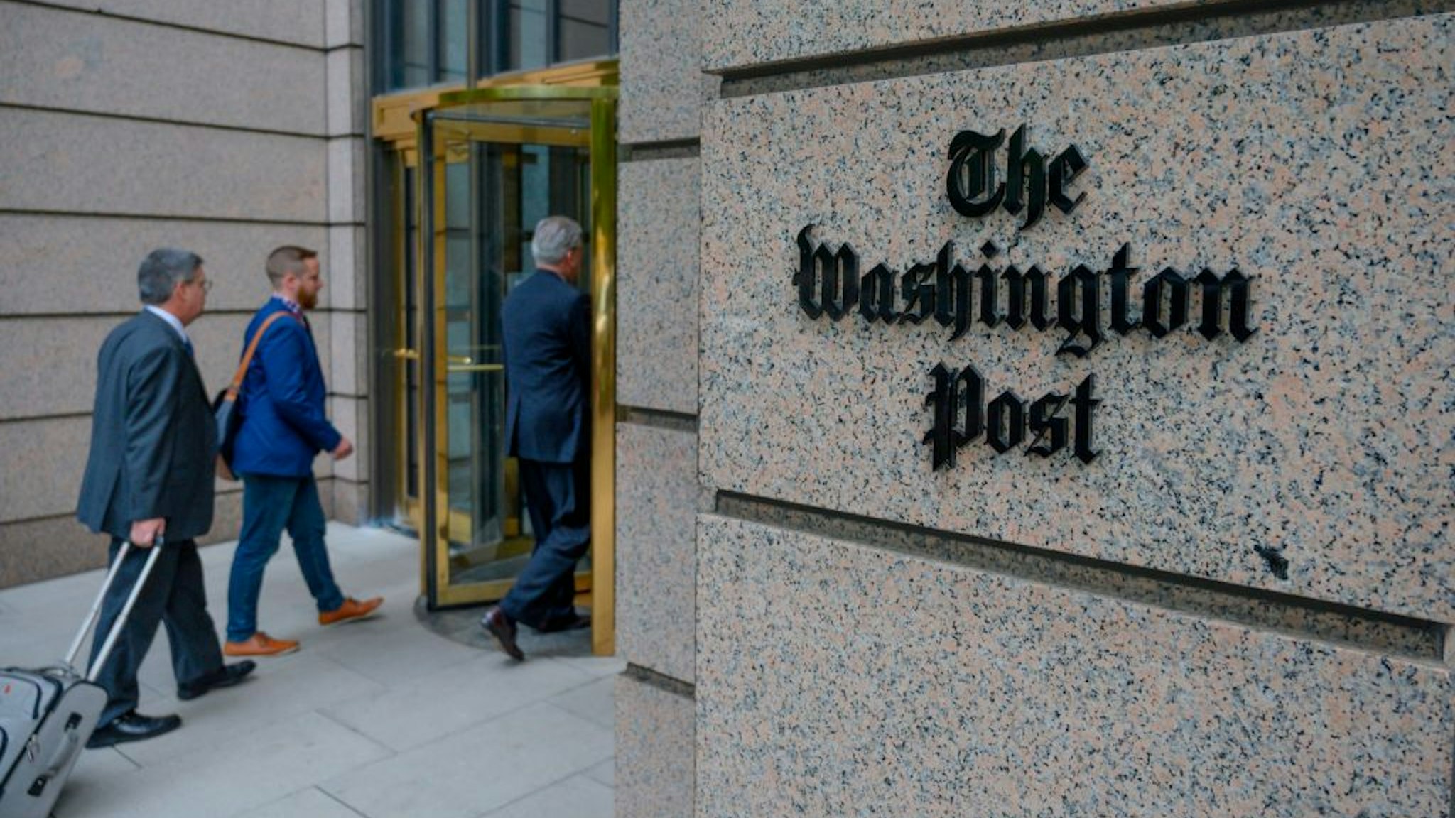 TOPSHOT - The building of the Washington Post newspaper headquarter is seen on K Street in Washington DC on May 16, 2019. - The Washington Post is a major American daily newspaper published in Washington, D.C., with a particular emphasis on national politics and the federal government. It has the largest circulation in the Washington metropolitan area. (Photo by Eric BARADAT / AFP)
