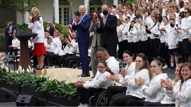 WASHINGTON, DC - MAY 04: (L-R) U.S. first lady Jill Biden, President Joe Biden, Vice President Kamala Harris and her husband Douglas Emhoff welcome Team USA during an event at the South Lawn of the White House May 4, 2022 in Washington, DC. President Biden and first lady Jill Biden hosted Team USA to celebrate their participation and success in the Tokyo 2020 Summer Olympic and Paralympic Games and Beijing 2022 Winter Olympic and Paralympic Games.