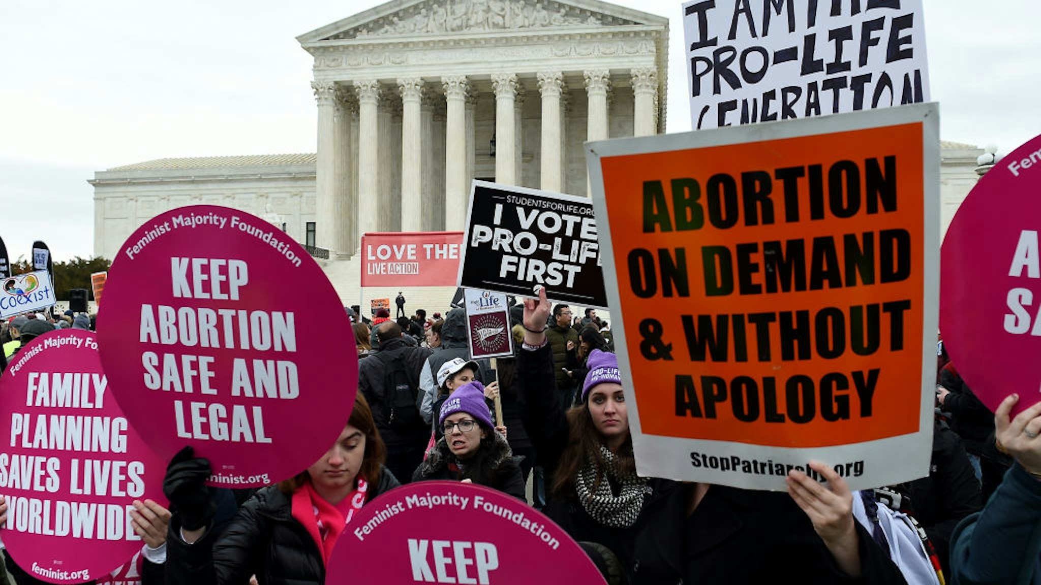 Pro-choice and pro-life activists demonstrate in front of the the US Supreme Court during the 47th annual March for Life on January 24, 2020 in Washington, DC. - Activists gathered in the nation's capital for the annual event to mark the anniversary of the Supreme Court Roe v. Wade ruling that legalized abortion in 1973.