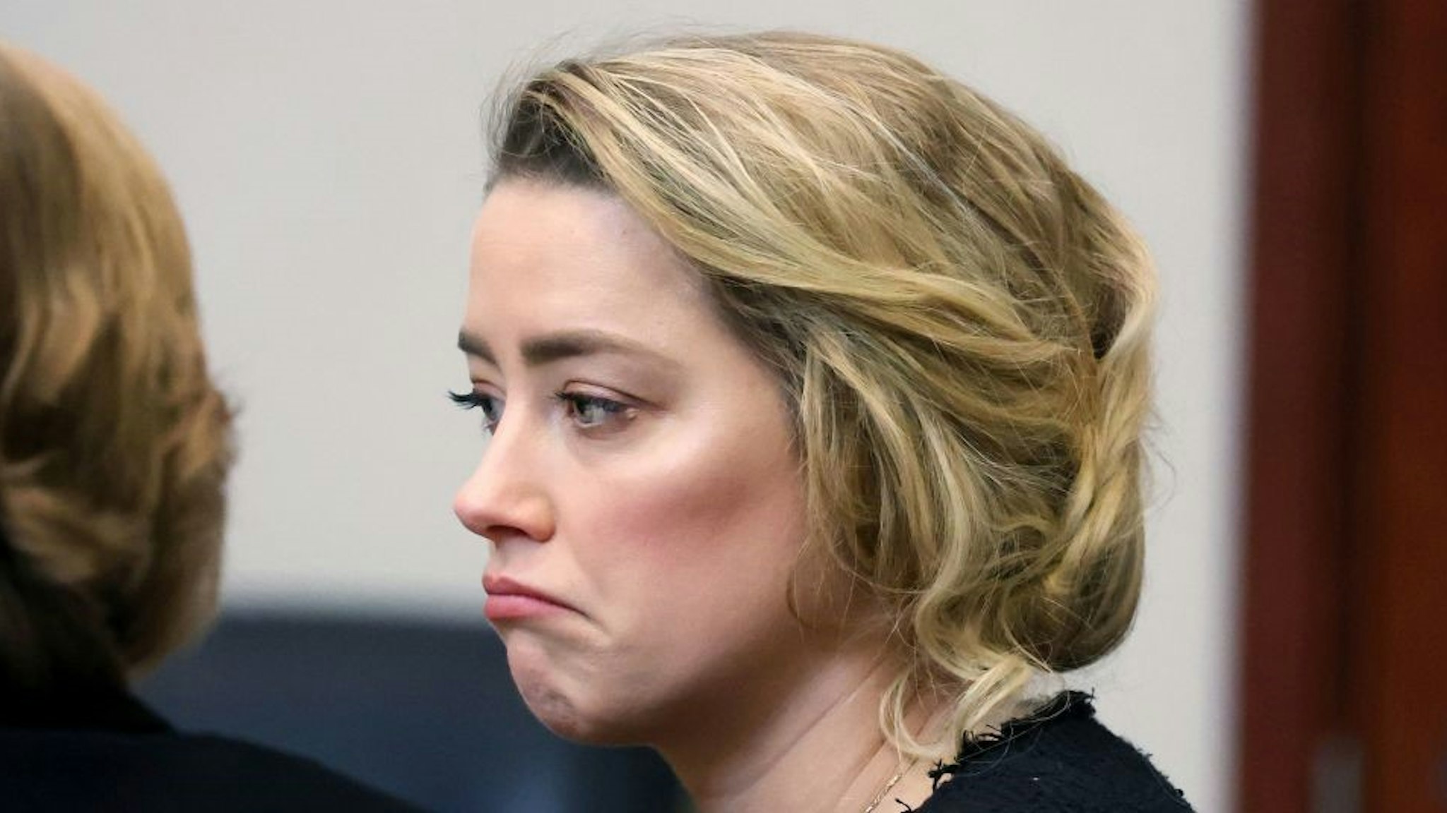 US actress Amber Heard during the 50 million US dollar Depp vs Heard defamation trial at the Fairfax County Circuit Court in Fairfax, Virginia, on April 28, 2022. - US actor Johnny Depp sued his ex-wife Amber Heard for libel in Fairfax County Circuit Court after she wrote an op-ed piece in The Washington Post in 2018 referring to herself as a "public figure representing domestic abuse." (Photo by Michael REYNOLDS / POOL / AFP) (Photo by