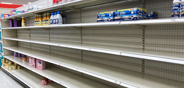 ORLANDO, FLORIDA, UNITED STATES - 2022/05/08: A nearly empty baby formula display shelf is seen at a Target store in Orlando. Stores across the United States have struggled to stock enough baby formula, causing some chains to limit customer purchases. While manufacturers report that they are producing at full capacity, it's still insufficient to meet the current demand, which has been aggravated by product recalls. (Photo by