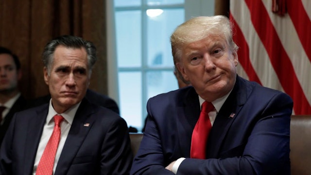 Senator Mitt Romney, a Republican from Utah, and U.S. President Donald Trump, right, participate in a listening session on youth vaping and electronic cigarettes in the Cabinet Room of the White House in Washington, D.C., U.S., on Friday, Nov. 22, 2019. Trump is pitting public-health advocates against vaping proponents and tobacco executives in an unusual White House meeting on Friday, as he considers whether to put in place strict curbs on e-cigarette flavors. Photographer:
