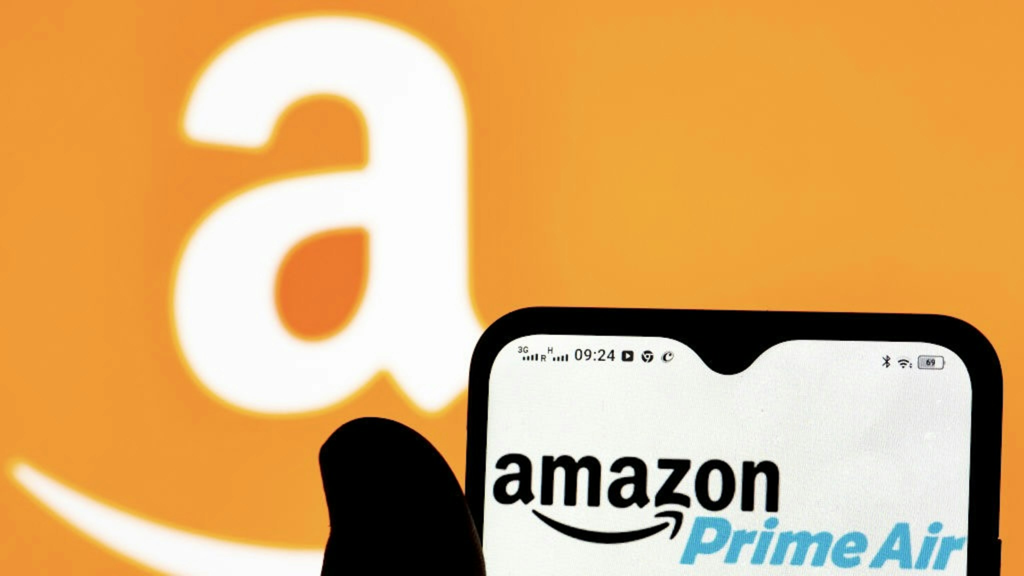 In this photo illustration an Amazon Prime Air logo seen... UKRAINE - 2022/01/09: In this photo illustration an Amazon Prime Air logo seen displayed on a smartphone. (Photo Illustration by Igor Golovniov/SOPA Images/LightRocket via Getty Images) SOPA Images / Contributor
