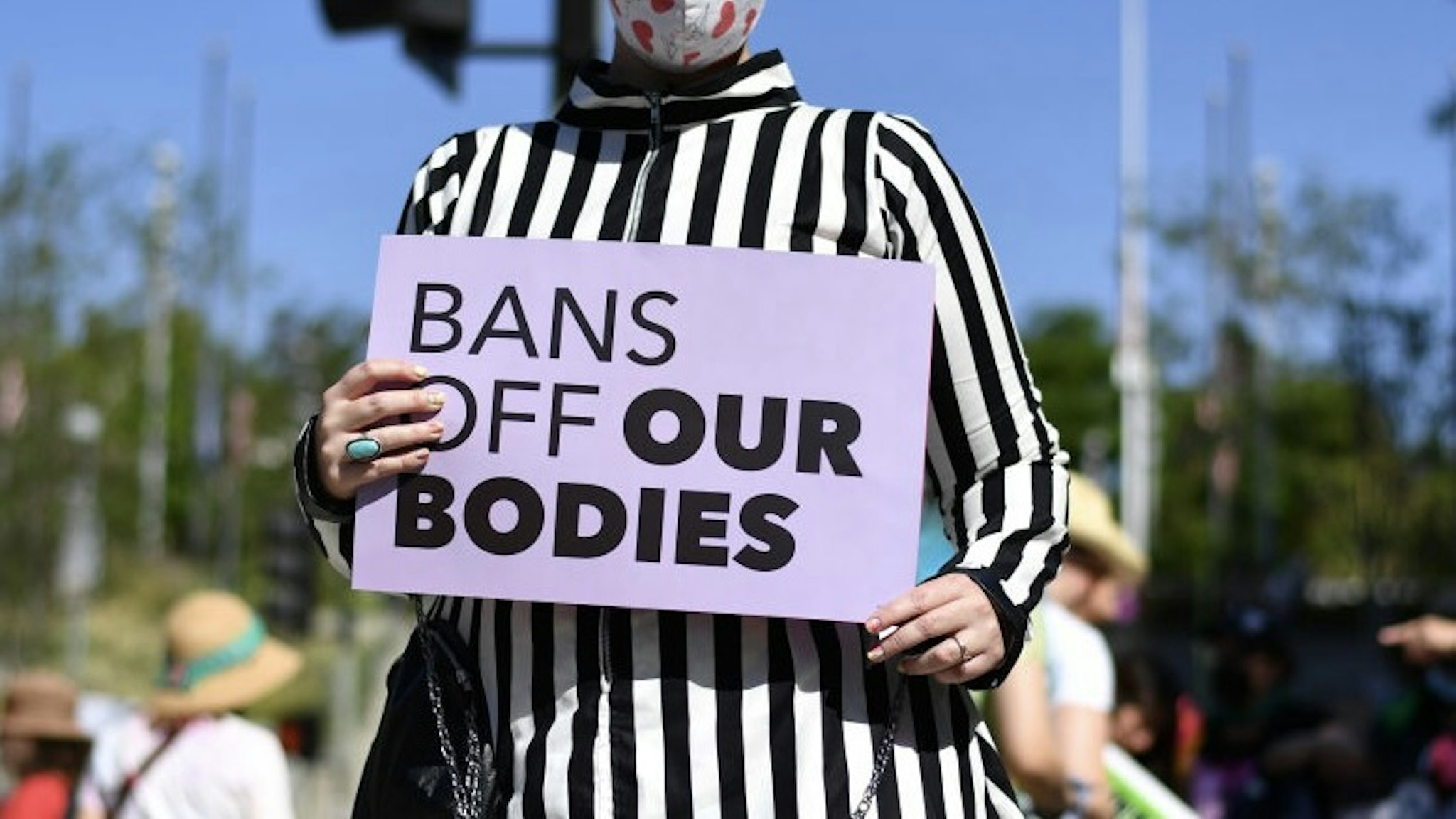 Women's March Foundation's National Day Of Action! The "Bans Off Our Bodies" Reproductive Rights Rally LOS ANGELES, CALIFORNIA - MAY 14: An abortion-rights protester attends the Women's March Foundation's National Day Of Action! The "Bans Off Our Bodies" reproductive rights rally at Los Angeles City Hall on May 14, 2022 in Los Angeles, California. In a leaked initial draft majority opinion obtained by Politico and authenticated by Chief Justice John Roberts, Supreme Court Justice Samuel Alito wrote that the cases Roe v. Wade and Planned Parenthood of Southeastern Pennsylvania v. Casey should be overturned, which would end federal protection of abortion rights across the country. (Photo by Sarah Morris/Getty Images) Sarah Morris / Contributor