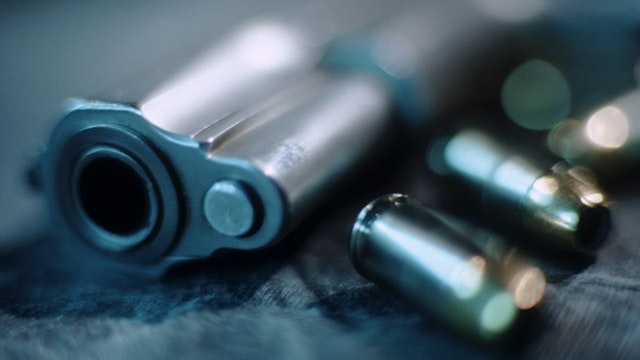 Gun and Bullets - stock photo Steve Prezant via Getty Images
