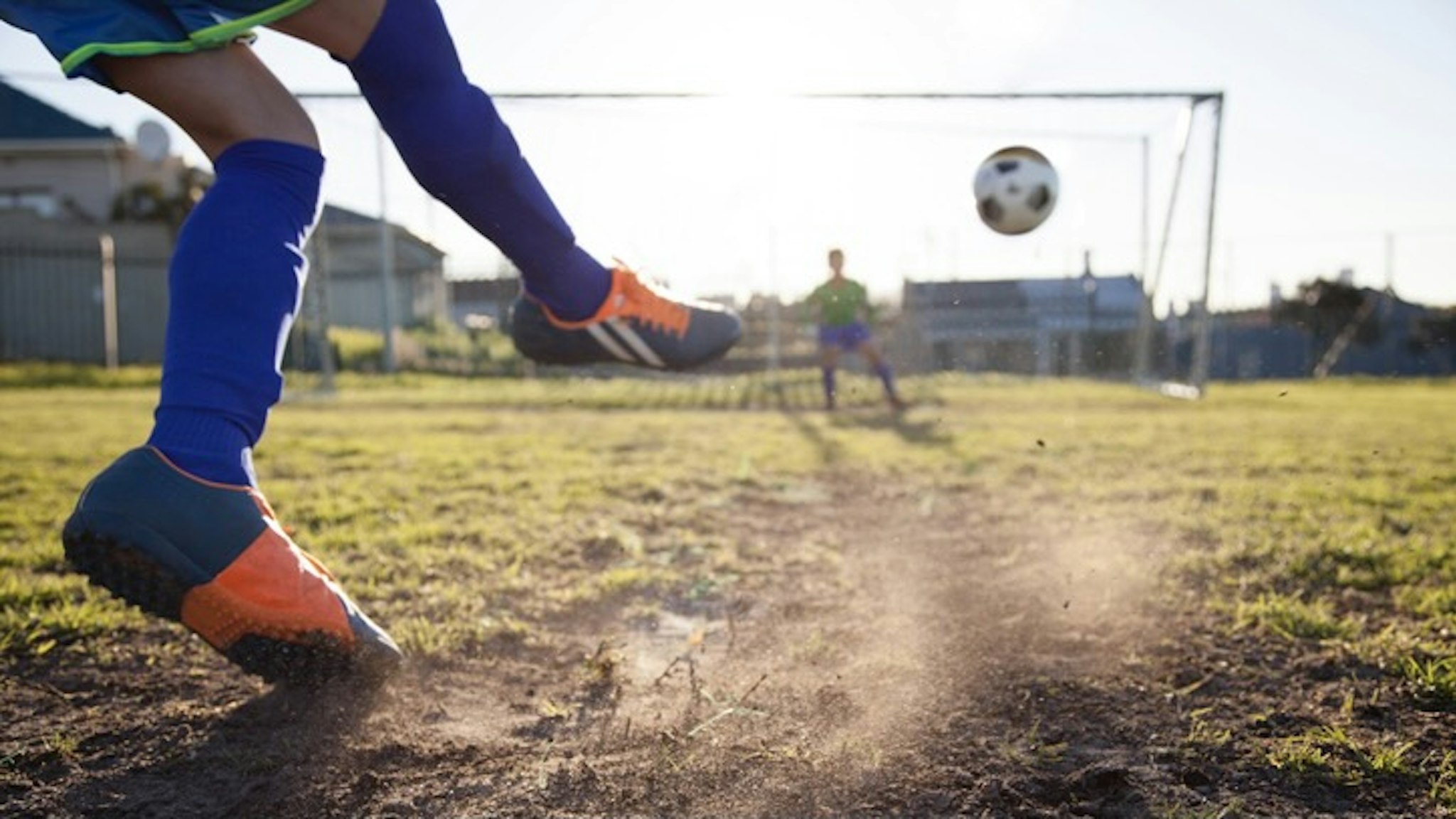Close up of boy taking soccer penalty - stock photo Close up action of boy, aged 14, taking a penalty kick in a football match Alistair Berg via Getty Images