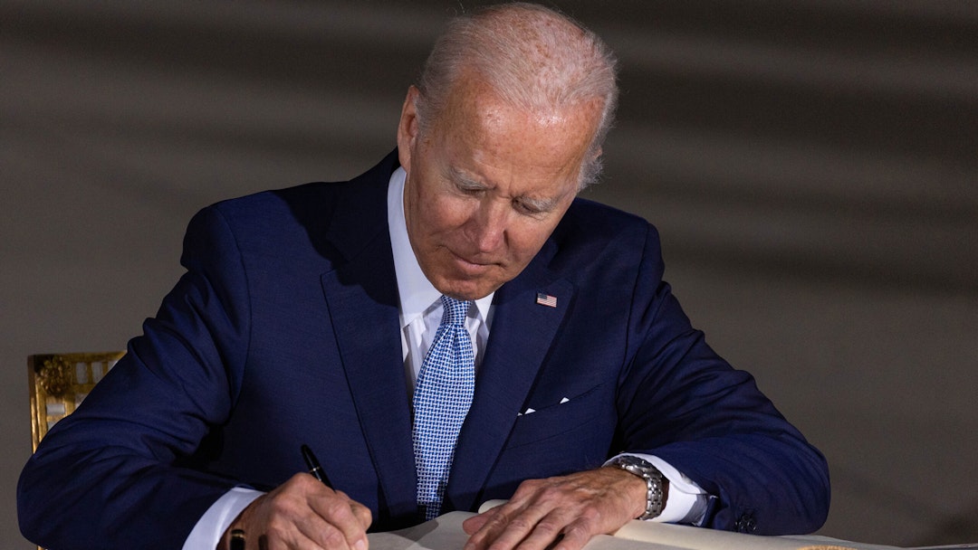 US President Joe Biden signs a Group of Seven (G-7) book after arriving at Munich Airport ahead of the G-7 leaders summit, in Munich, Germany, on Saturday, June 25, 2022.