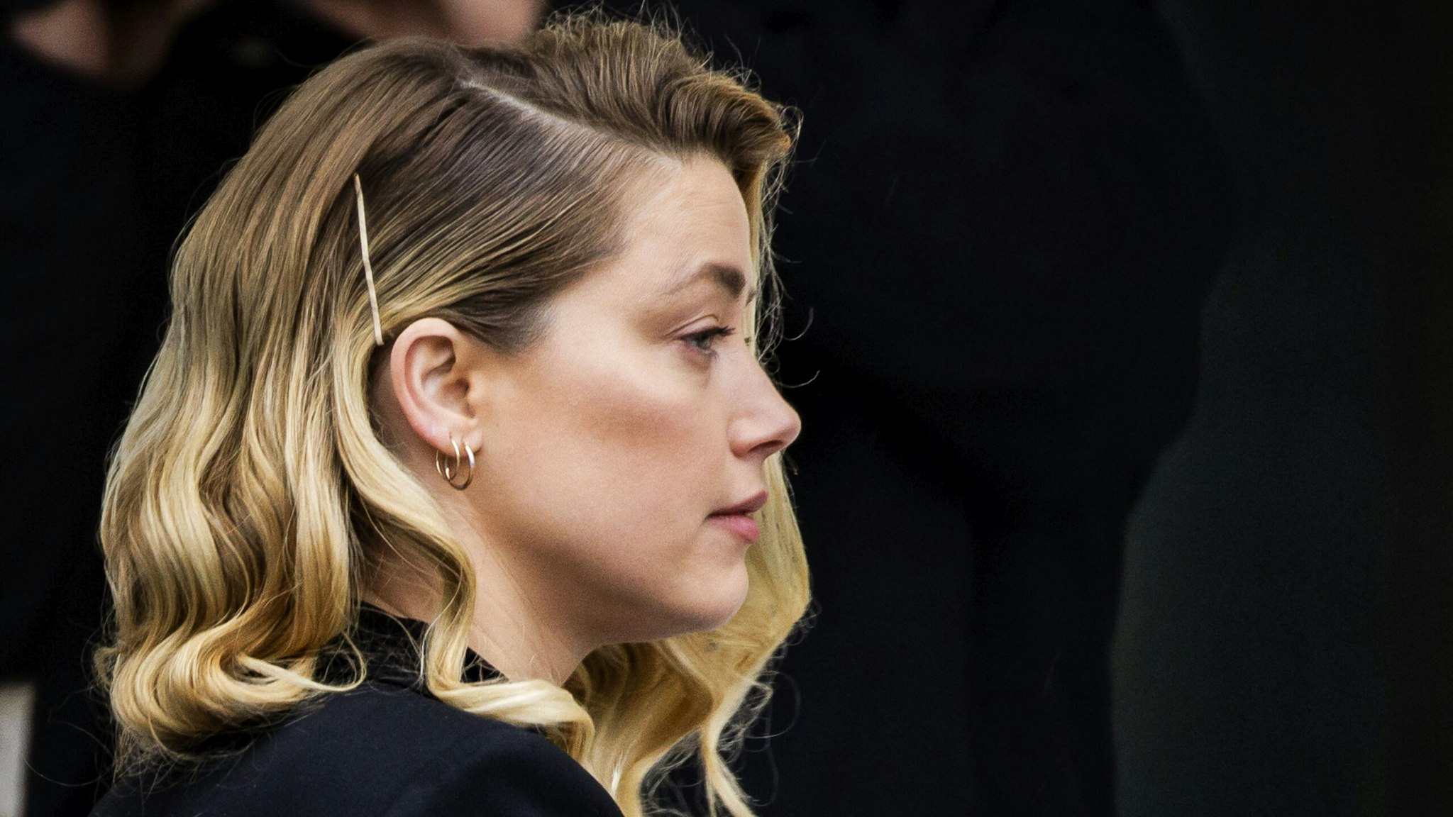 FAIRFAX, VA - APRIL 18: (NY &amp; NJ NEWSPAPERS OUT) Amber Heard arrives outside court during the Johnny Depp and Amber Heard civil trial at Fairfax County Circuit Court on April 18, 2022 in Fairfax, Virginia. Depp is seeking $50 million in alleged damages to his career over an op-ed Heard wrote in the Washington Post in 2018.