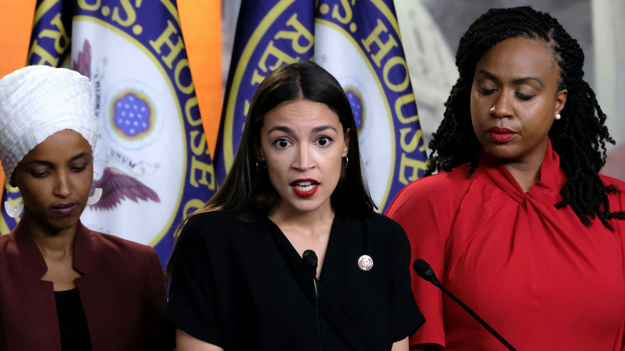 WASHINGTON, DC - JULY 15: U.S. Rep. Alexandria Ocasio-Cortez (D-NY) speaks as Reps. Ilhan Omar (D-MN) and Ayanna Pressley (D-MA) listen during a news conference at the U.S. Capitol on July 15, 2019 in Washington, DC. President Donald Trump stepped up his attacks on the four progressive Democratic congresswomen, saying that if they're not happy in the U.S. "they can leave."