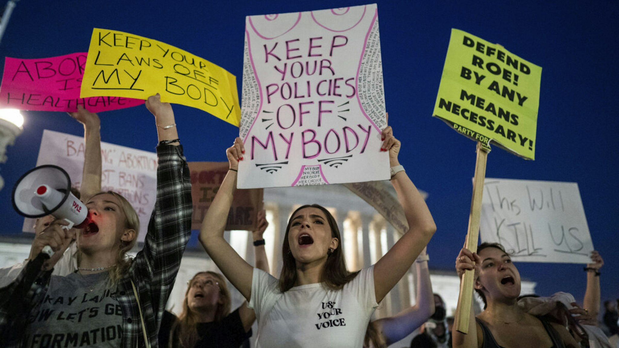 Pro-choice demonstrators, including Emma Harris, left, and Ellie Small, center, both students at George Washington University gather in front of the Supreme Court of the United States on Tuesday, May 3, 2022 in Washington, DC.