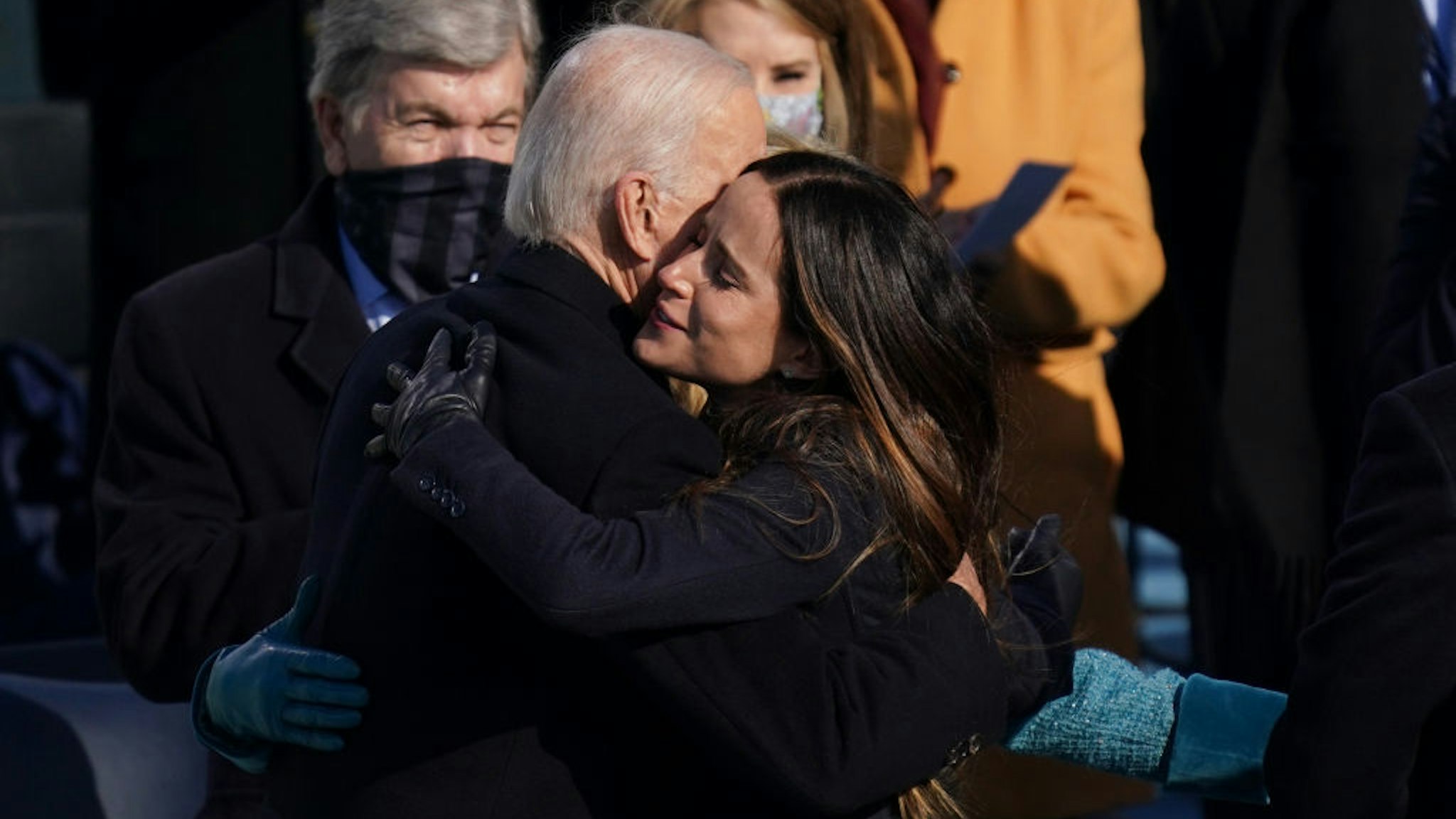 Joe Biden hugged his daughter Ashley after he was sworn in as the 46th President of the United States on Capitol Hill in Washington, DC on January 20, 2020. (Erin Schaff/The New York Times NYTINAUG