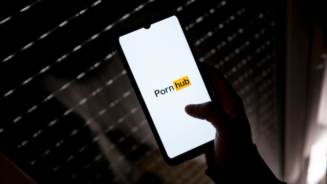 In this photo illustration a PornHub logo seen displayed on a smartphone screen in Athens, Greece on March 16, 2022.