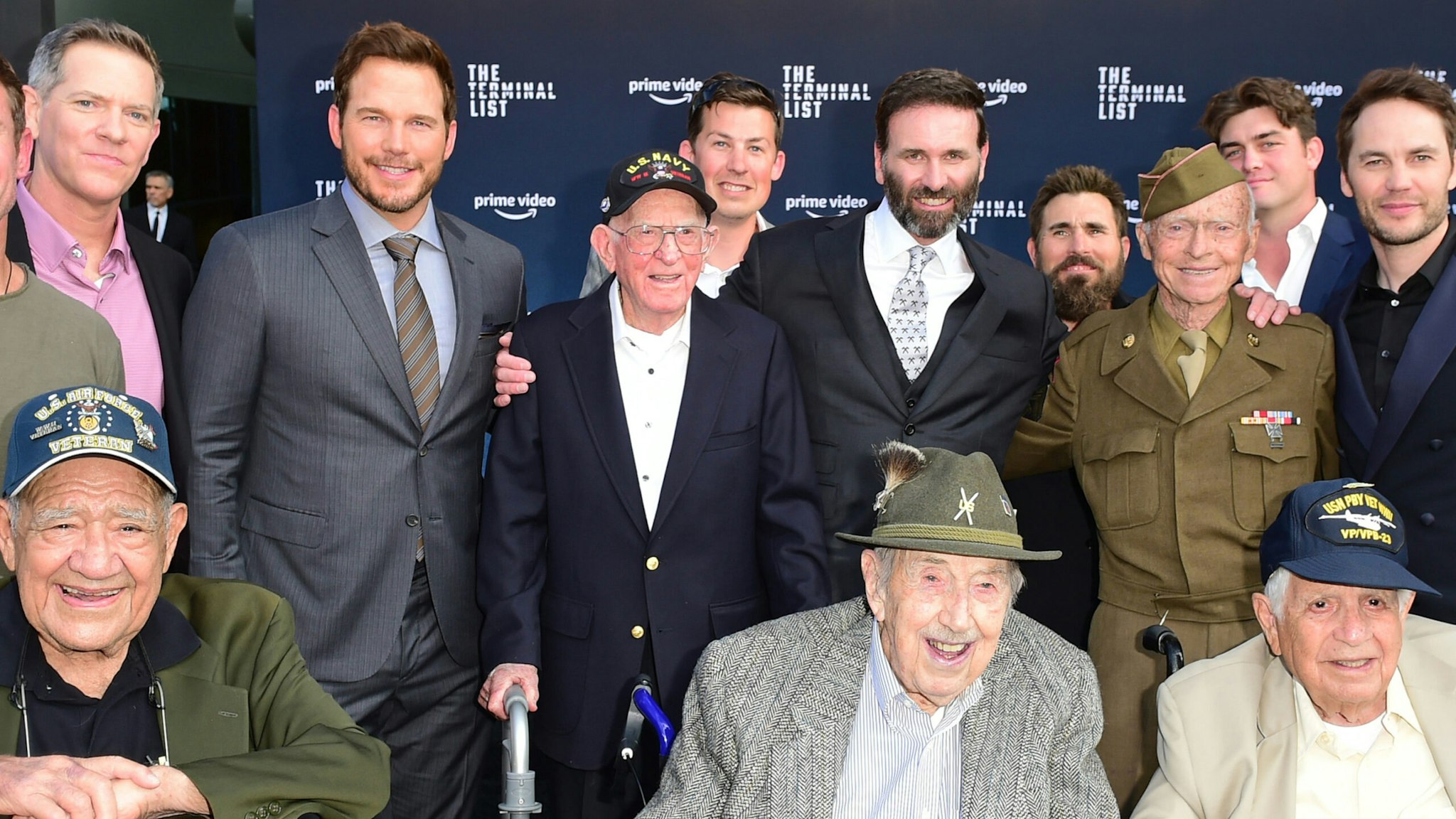 (L-R) Nate Boyer, WWII Veteran Larry Stevens, David DiGilio, Chris Pratt, WWII Veteran Pete Corrao, Jack Carr, WWII Veteran Bruce Campbell, Jared Shaw, WWII Veteran Andre Chappaz, WWII Veteran Art Del Rey, and Taylor Kitsch attend Prime Video's "The Terminal List" Red Carpet Premiere on June 22, 2022 in Los Angeles, California.