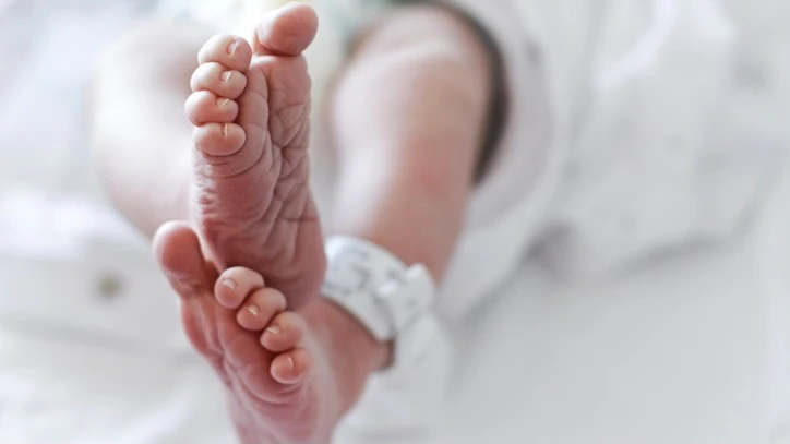 Newborn baby boy at hospital with identity tag on feet, close up - stock photo Newborn baby boy at hospital with identity tag on feet, close up Isabel Pavia via Getty Images