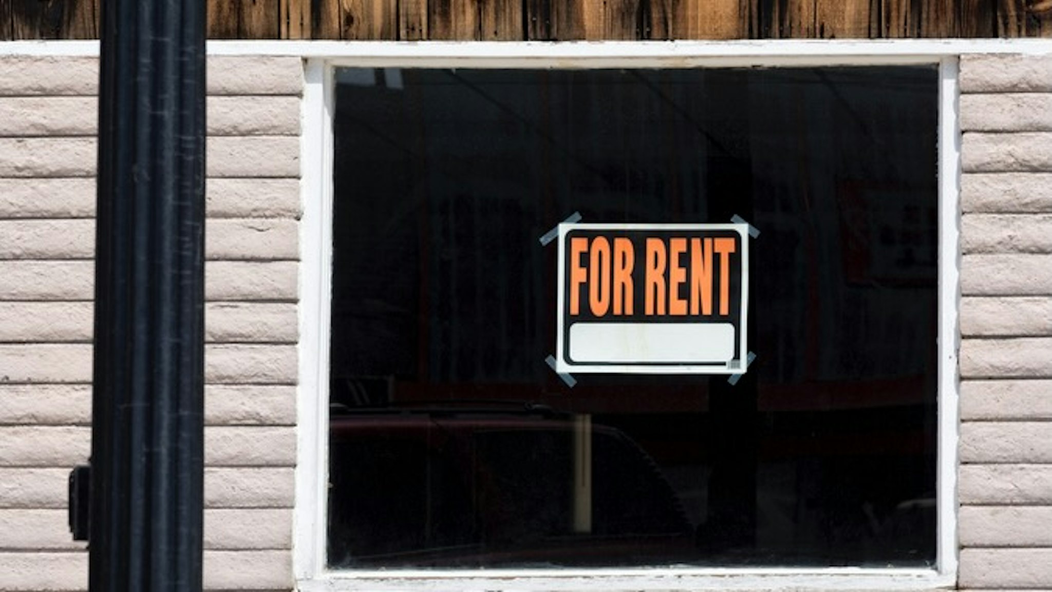 For Rent sign in a window - stock photo Thomas Winz via Getty Images