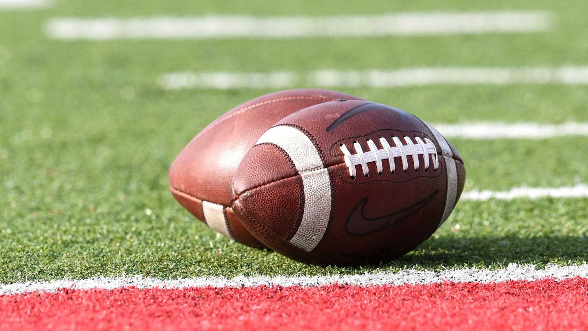 MUNCIE, IN - SEPTEMBER 02: Nike footballs sit on the goal line prior to a college football game between the Western Illinois Leathernecks and Ball State Cardinals on September 2, 2021 at Scheumann Stadium in Muncie, IN.
