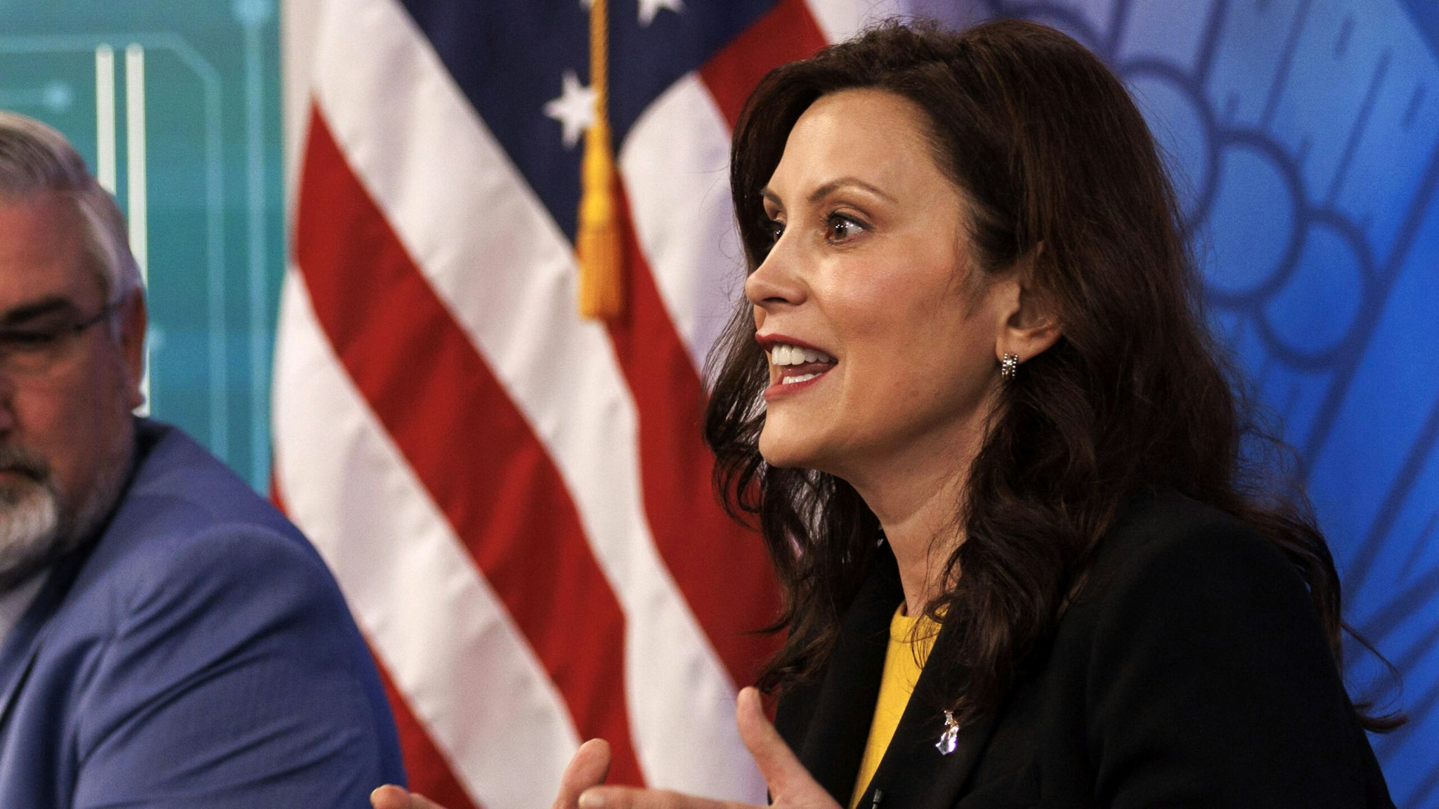 Gretchen Whitmer, governor of Michigan, right, speaks during a meeting with U.S. President Joe Biden, business leaders and governors in the Eisenhower Executive Office Building in Washington, D.C., U.S., on Wednesday, March 9, 2022. The Biden administration's long-awaited executive order for government agencies to take a closer look at issues surrounding the crypto market is being celebrated by industry participants despite it lacking a clear path on possible regulation.