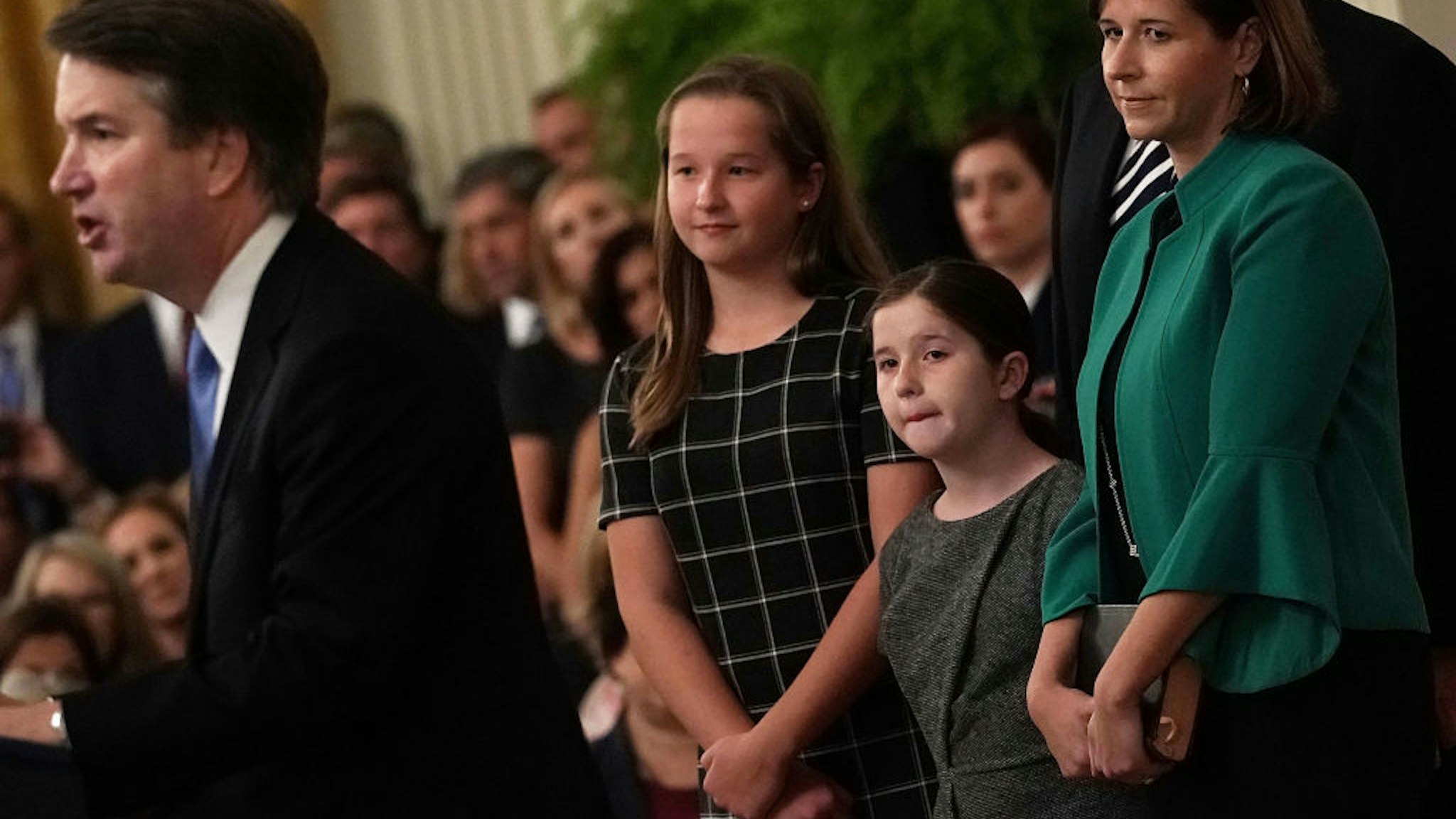 WASHINGTON, DC - OCTOBER 08: U.S. Supreme Court Justice Brett Kavanaugh (L) speaks as his wife Ashley (R), daughters Liza (2nd L) and Margaret (3rd L) look on during a ceremonial swearing in at the East Room of the White House October 08, 2018 in Washington, DC. Kavanaugh was confirmed in the Senate 50-48 after a contentious process that included several women accusing Kavanaugh of sexual assault. Kavanaugh has denied the allegations. (Photo by Alex Wong/Getty Images)