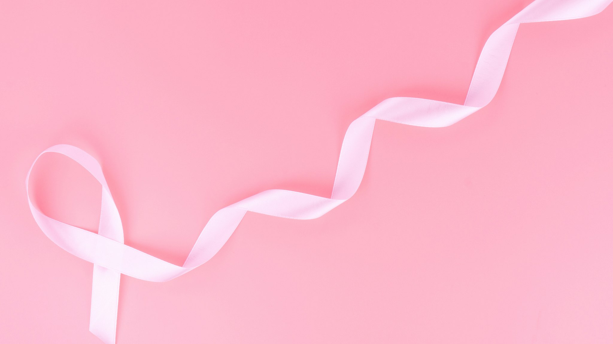 Directly Above Shot Of Ribbon Over Pink Background - stock photo