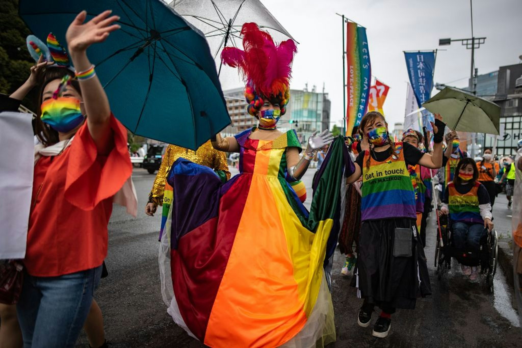 People attend the Tokyo Rainbow Pride 2022 Parade in Tokyo on April 24, 2022, to show support for members of the LGBT community. - -- IMAGE RESTRICTED TO EDITORIAL USE -- (Photo by Philip FONG / AFP) / -- IMAGE RESTRICTED TO EDITORIAL USE -- (Photo by PHILIP FONG/AFP via Getty Images)
