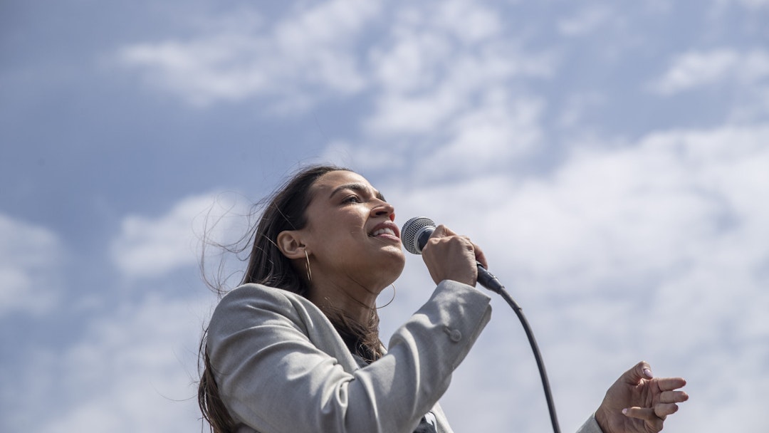 Representative Alexandria Ocasio-Cortez, a Democrat from New York, speaks during an Amazon Labor Union (ALU) rally in the Staten Island borough of New York, U.S., on Sunday, April 24, 2022. Senator Bernie Sanders visited Staten Island to meet with workers who this month successfully organized the first union in the country at an Amazon facility and workers at a separate facility who will be voting next week on whether to join a union.