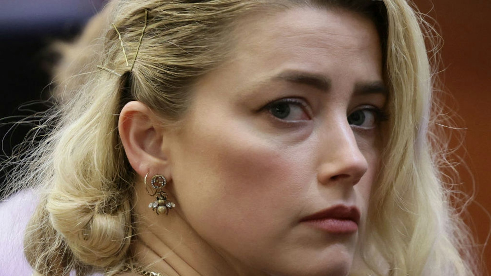 Actor Amber Heard waits before the jury said that they believe she defamed ex-husband Johnny Depp while announcing split verdicts in favor of both her ex-husband Johnny Depp and Heard on their claim and counter-claim in the Depp v. Heard civil defamation trial at the Fairfax County Circuit Courthouse in Fairfax, Virginia, on June 1, 2022.