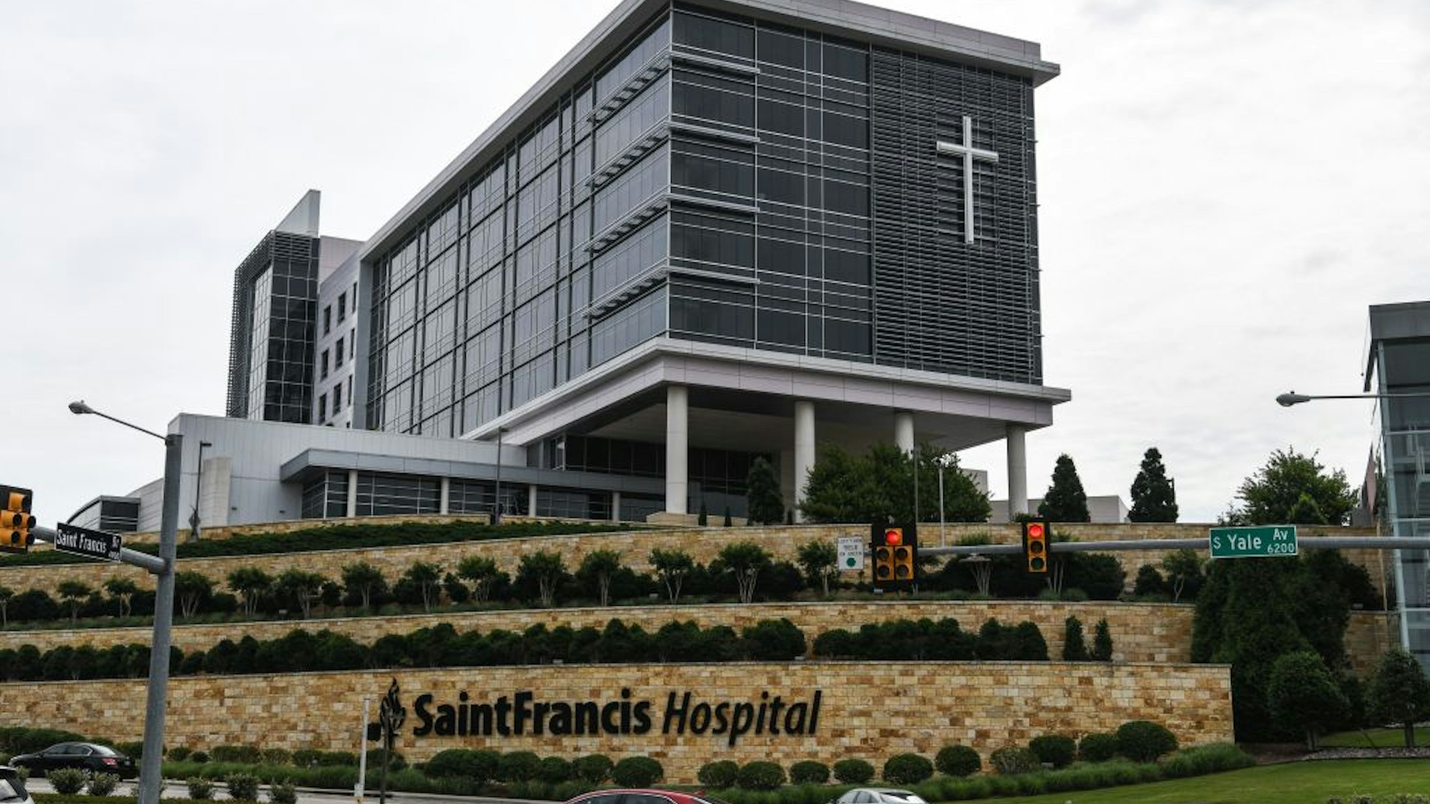 Cars drive past the Saint Francis Hospital campus in Tulsa, Oklahoma, on June 2, 2022. - A gunman has killed at least four people at the hospital, police said -- the latest in a string of mass shootings across the US in recent weeks.