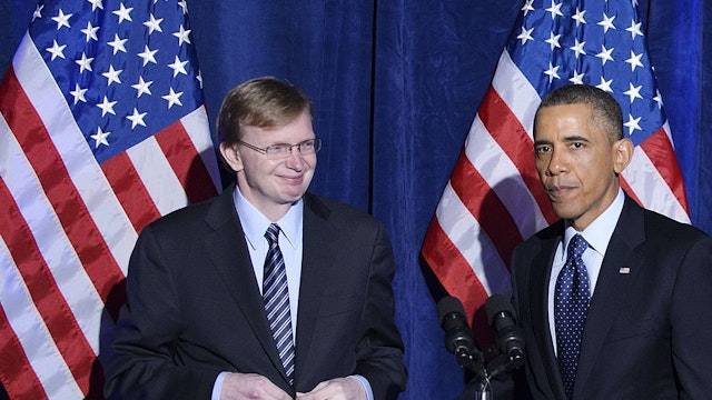 US President Barack Obama speaks as Organizing for Action head Jim Messina (L) looks on during an Organizing for Action dinner on March 13, 2013 at the St. Regis Hotel in Washington, DC. Messina was the manager of Obama's 2012 re-election campaign. AFP PHOTO/Mandel NGAN (Photo credit should read MANDEL NGAN/AFP via Getty Images)