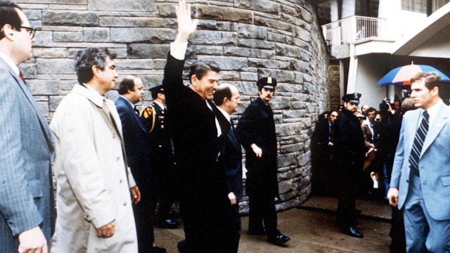 President Ronald Reagan Waves To Onlookers Moments Before An Assassination Attempt