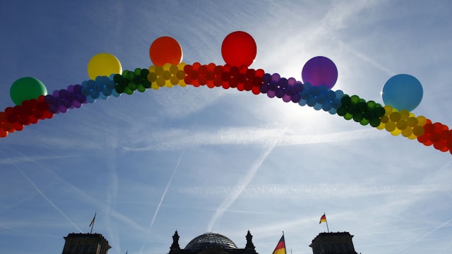 BERLIN, GERMANY - MAY 17: Rainbow coloured balloons hang in front of the Bundestag during a protest of the Gay, Lesbian, Bisexual and Transgender community and part of the labour syndicates on May 17, 2017 in Berlin, Germany. Today is International Day Against Homophobia, Transphobia and Biphobia and takes place at the same time in almost 120 countries and aims to raise awareness of LGBT rights and violations still happening in many regions worldwide. (Photo by Michele Tantussi/Getty Images)
