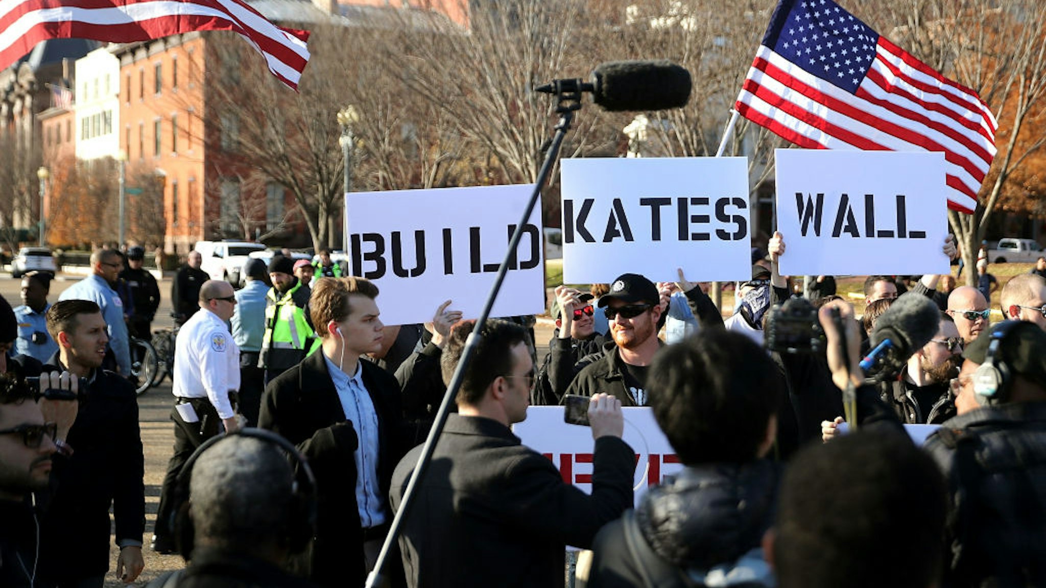 WASHINGTON, DC - DECEMBER 03: A phalanx of Metropolitan Police Department officers create a barrier around white nationalists and neo-Nazis as they rally in front of the White House December 3, 2017 in Washington, DC. The facists held an anti-immigration rally in response to this week's acquittal of an undocumented Mexican immigrant in the 2015 shooting death of Kate Steinle in San Francisco. (Photo by Chip Somodevilla/Getty Images)