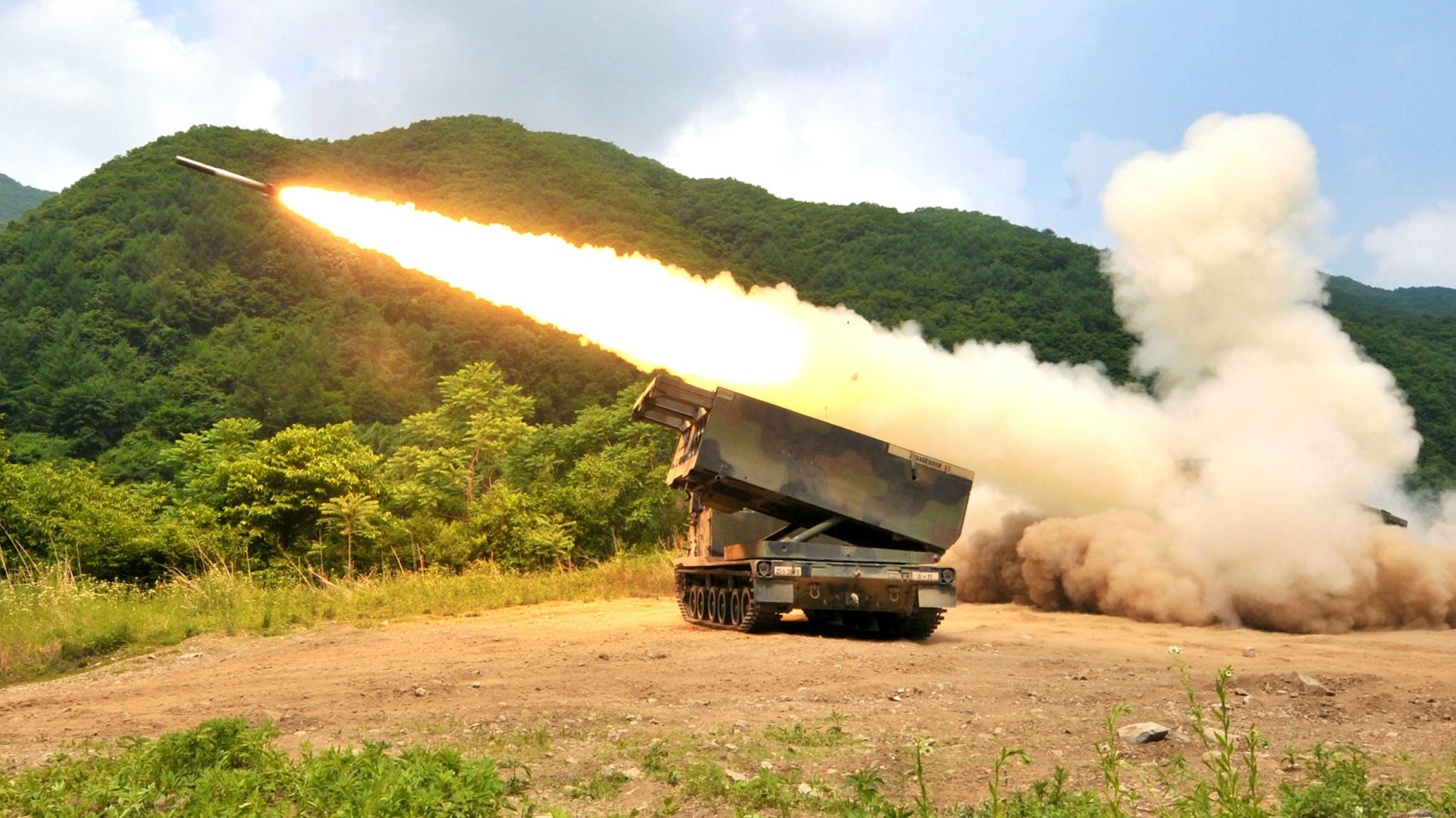 US Multiple Launch Rocket System (MLRS) launches a rocket into the air during a live fire training exercise in the South Korean border county of Cheorwon on June 12, 2012. The US military in South Korea has asked the Pentagon to provide more attack helicopters and strengthen missile defence systems, its chief said, amid threats by North Korea against the South.