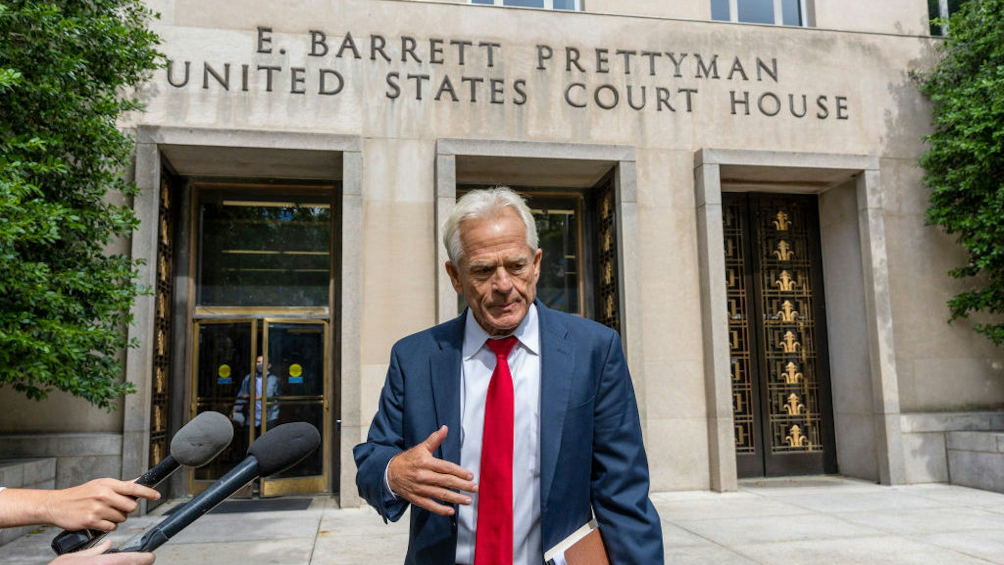 WASHINGTON, DC - JUNE 03: Peter Navarro talks to reporters after his hearing in federal court on June 03, 2022 in Washington, DC. A federal grand jury indicted former Trump White House adviser Peter Navarro for contempt of Congress after refusing to cooperate with the House January 6 Committee’s investigation. (Photo by Tasos Katopodis/Getty Images)