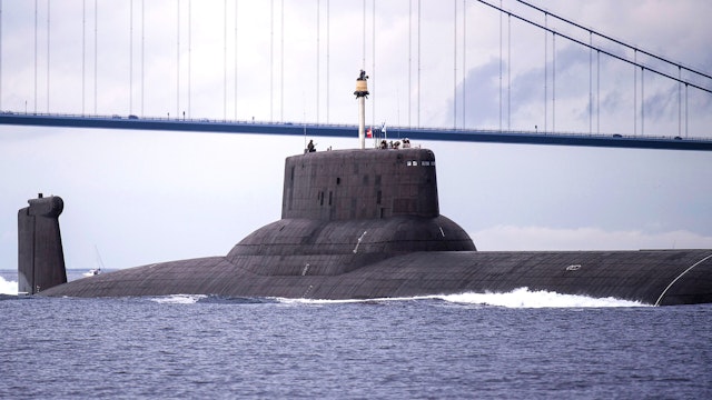 The Russian nuclear submarine Dmitrij Donskoj sails sails under the Great Belt Bridge between Jyutland and Fun through Danish waters, near Korsor, on July 21, 2017, on it's way to Saint Petersburg to participate in the 100th anniversary of the Russian Navy, held in on 29th - 30th July. The submarine is 172 meters long and is thus the largest nuclear powered submarine in the world, and it's the first time it sails into the Baltic Sea.