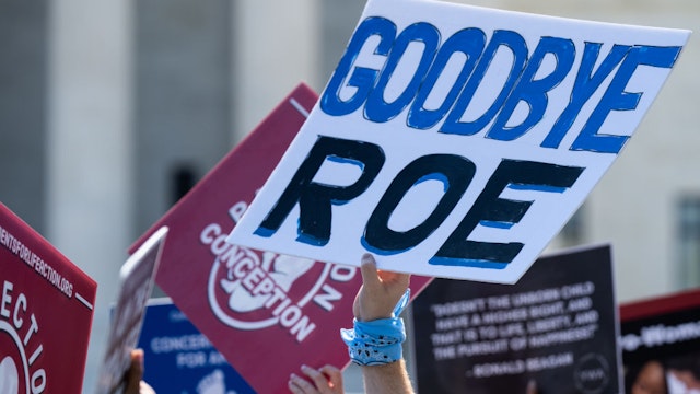 UNITED STATES - JUNE 13: Pro-life activists protest outside of the U.S. Supreme Court as they wait for the court to hand down its decision to overturn Roe v. Wade on Monday morning, June 13, 2022.