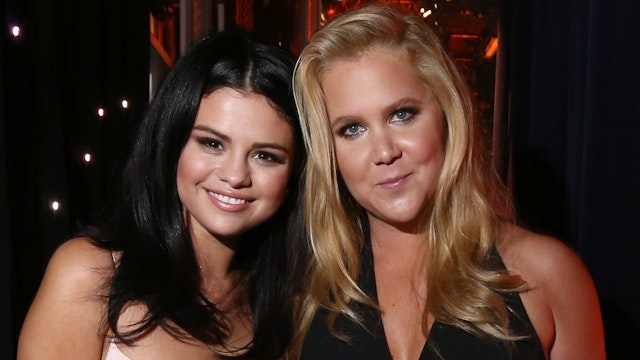 Singer Selena Gomez (L) and Hollywood Comedy Award honoree Amy Schumer pose onstage during the 19th Annual Hollywood Film Awards at The Beverly Hilton Hotel on November 1, 2015 in Beverly Hills, California.