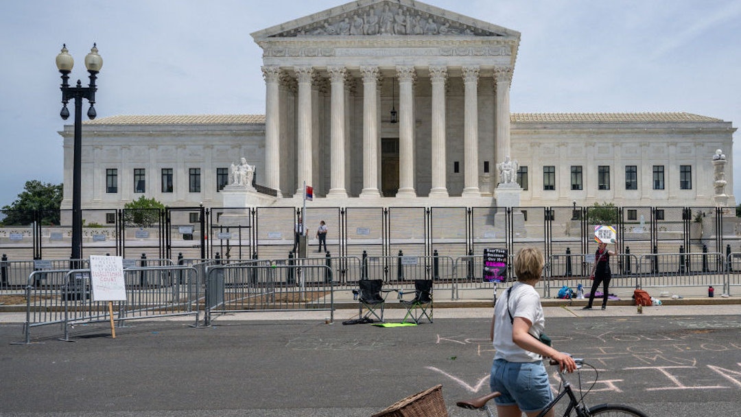 WASHINGTON, DC - JUNE 21: Abortion-rights activist Sadie, 28, stands alone with a sign in front of the U.S. Supreme Court Building on June 21, 2022 in Washington, DC. The Court continues to release opinions as the country awaits a major case decision pertaining to abortion rights. (Photo by Brandon Bell/Getty Images)