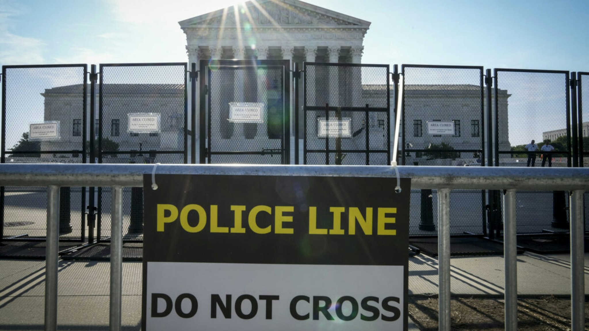 A view of the U.S. Supreme Court through security fencing on May 31, 2022 in Washington, DC. According to media reports, Supreme Court officials are escalating their search for the source of the leaked draft opinion that would overturn Roe v. Wade