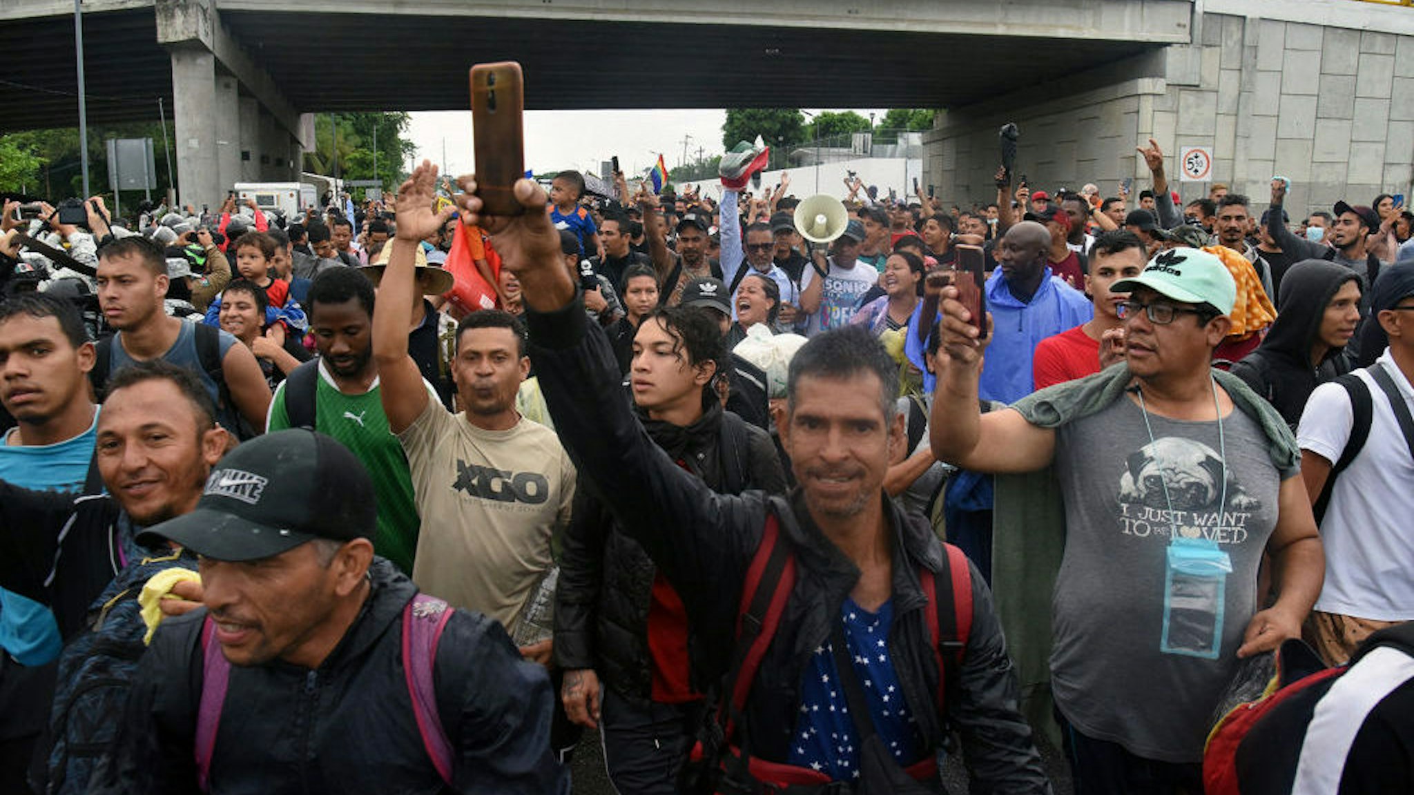 Migrants from Central and South America take part in a caravan towards the border with the United States, in Tapachula, Chiapas state, Mexico, on June 6, 2022. (Photo by ISAAC GUZMAN / AFP) (Photo by ISAAC GUZMAN/AFP via Getty Images)
